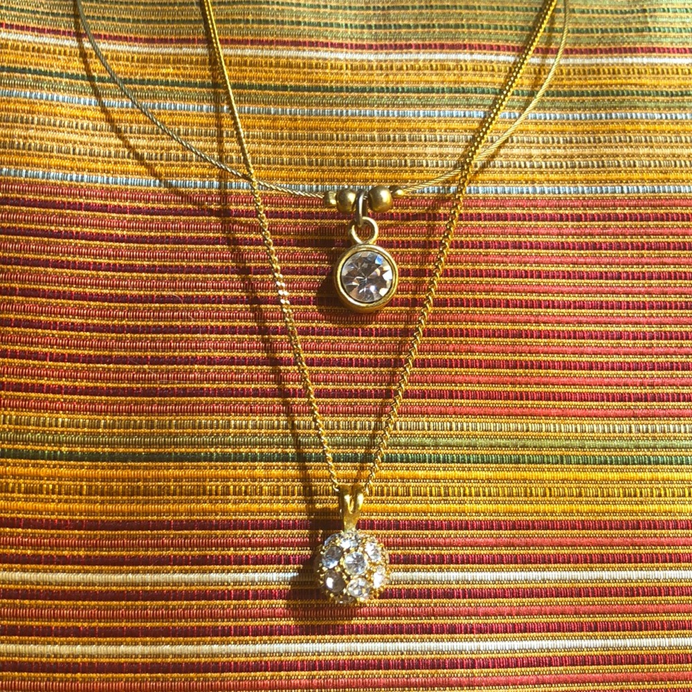 Two blingy gold tone necklaces